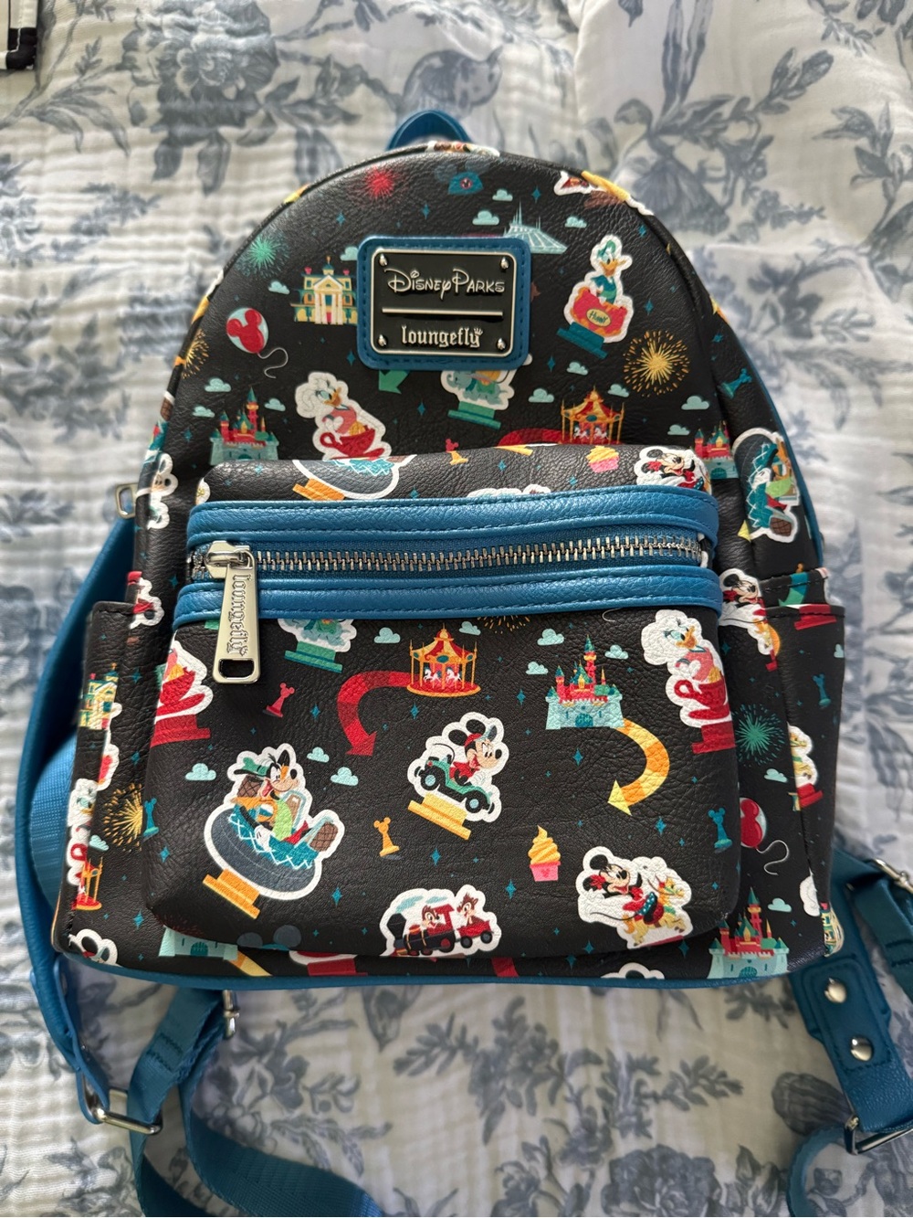Loungefly Black Backpack with blue Accents and Multicolor Park Print